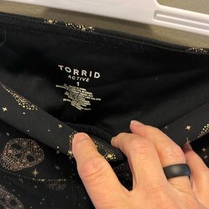 TORRID! Black Capri leggings covered with gold foil Skulls!